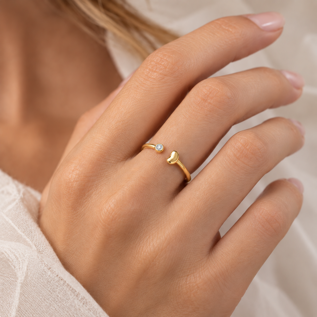The Ever Bean ring in gold, worn on hand