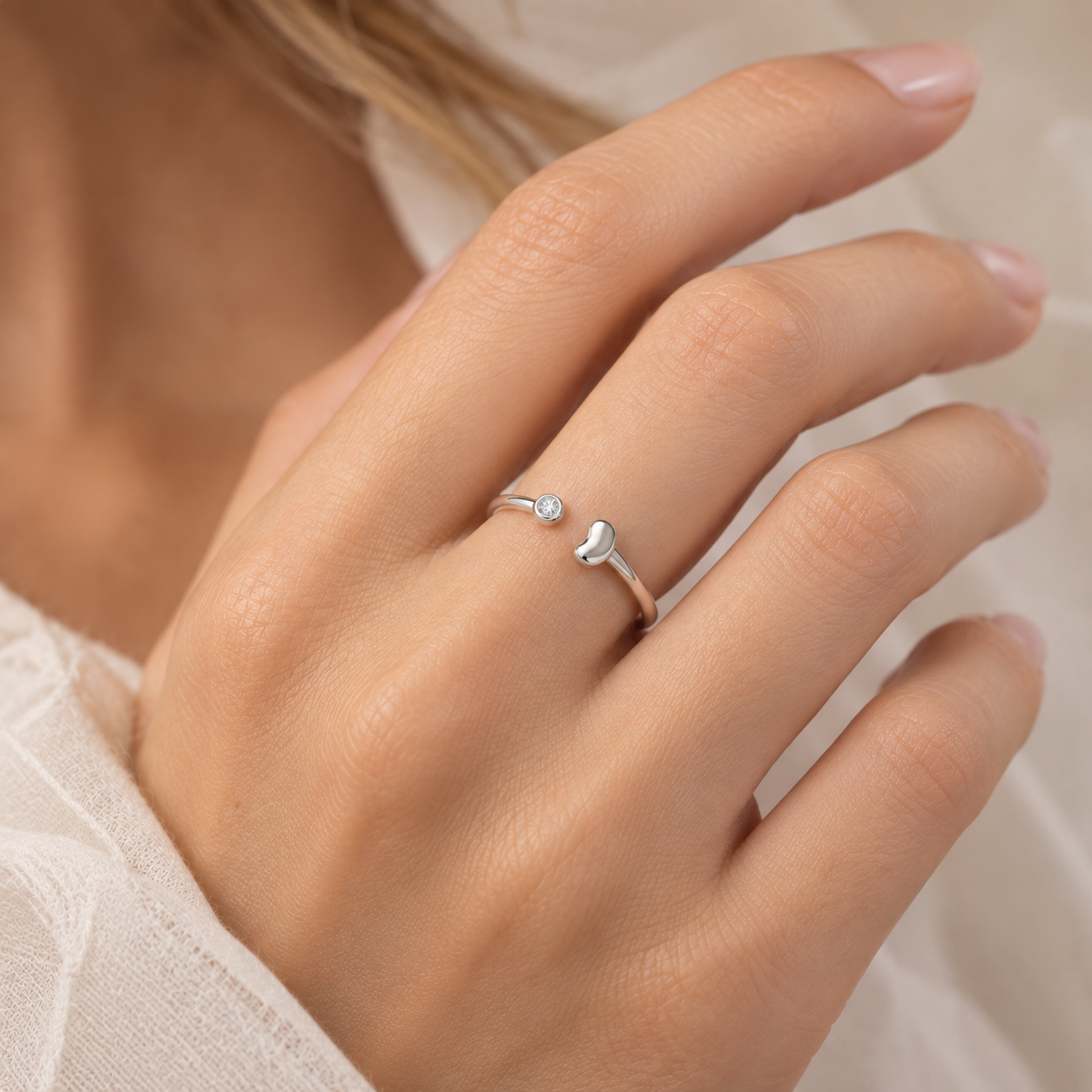The Ever Bean ring in silver, worn on hand